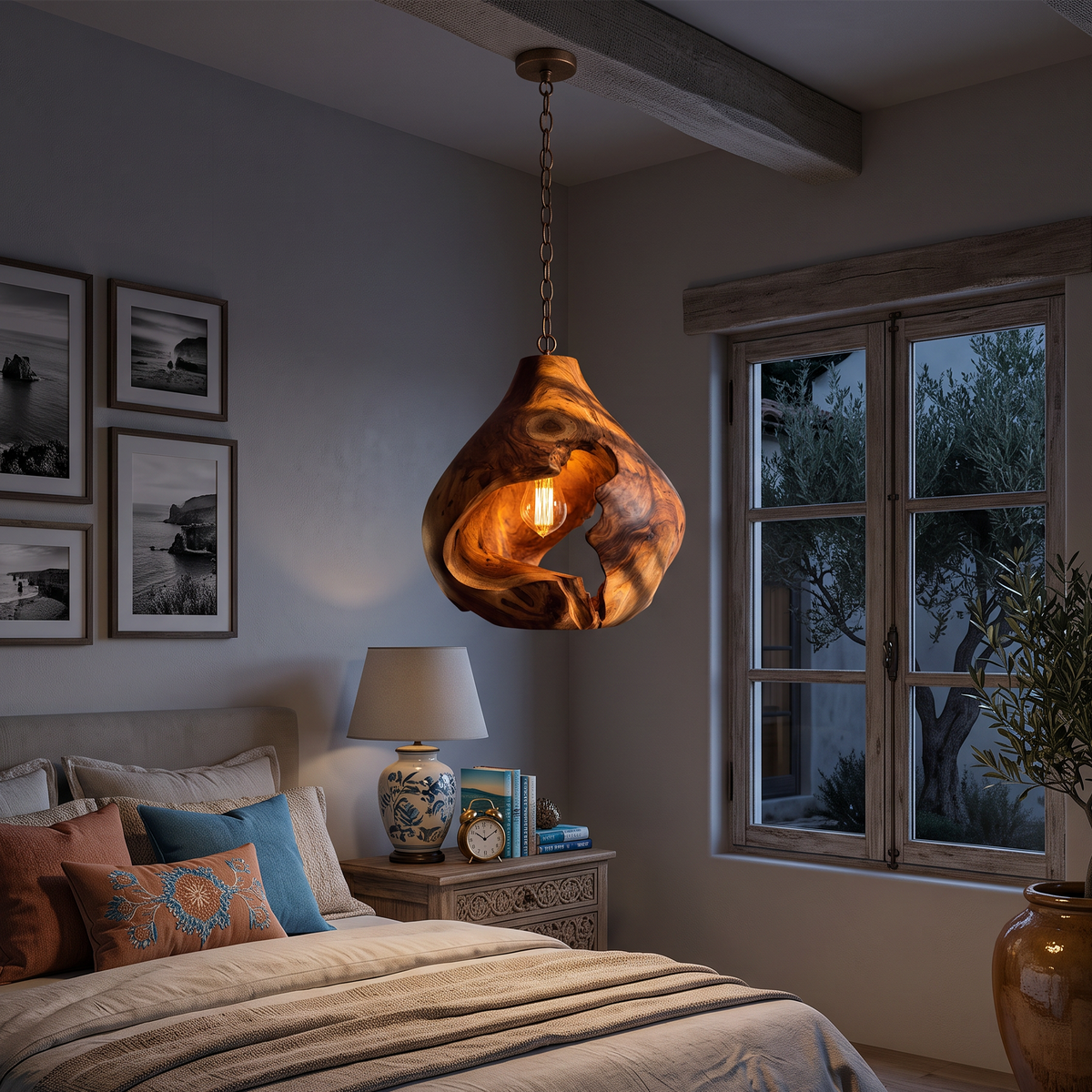Organic pendant lamp hanging above a bed in a bedroom